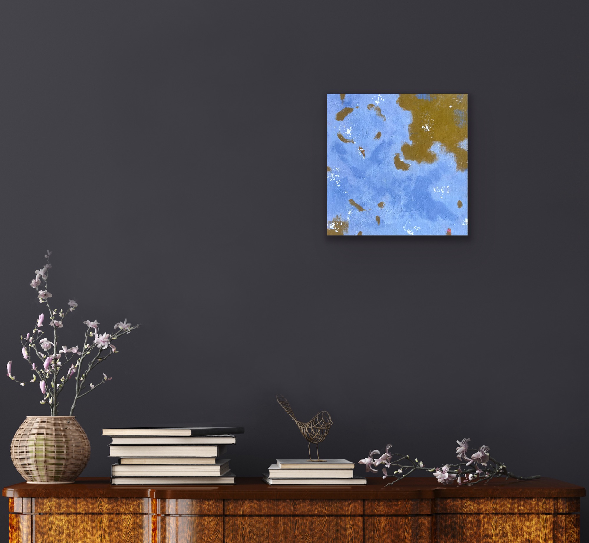 A photo of a small square blue painting on a dark blue background