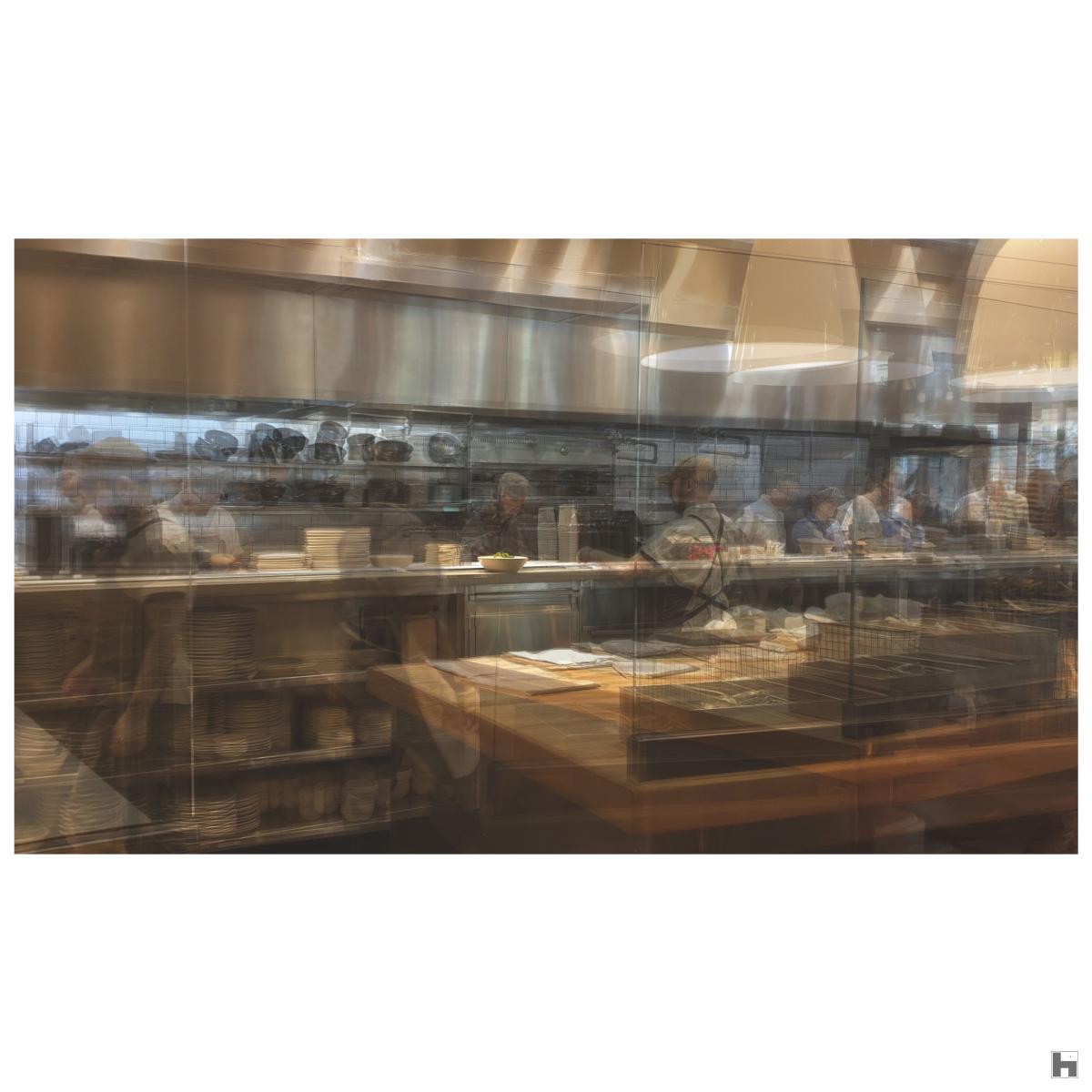 A multilayered photo of a restaurant kitchen