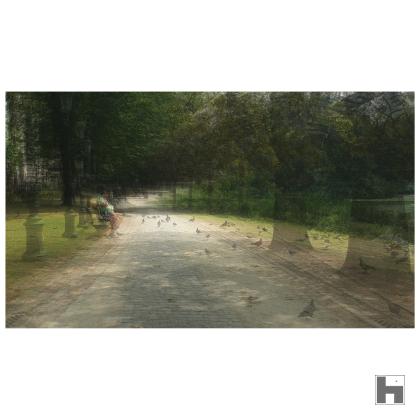 A multilayered photo of a solitary man in a park