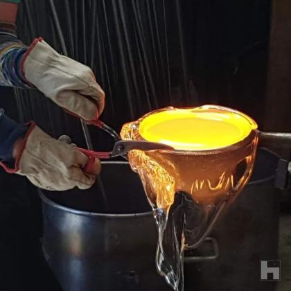 the process involves casting hot glass at 1150 - 1200°C