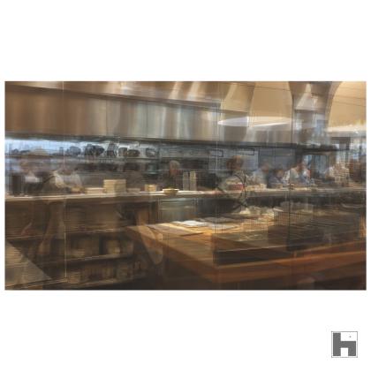 A multilayered photo of a restaurant kitchen