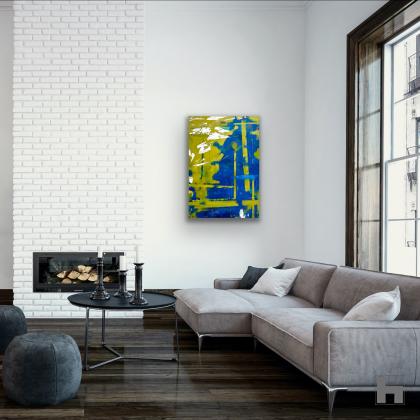 An abstract green and blue painting in a living room