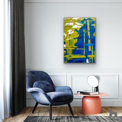 A blue and green abstract painting in a sitting room