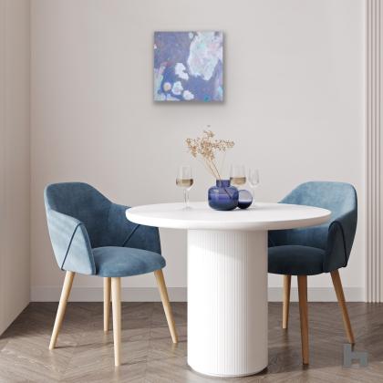 A soft grey painting in a dining room above a table and chairs